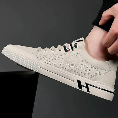https://cdn.shopify.com/s/files/1/0807/0745/3272/products/Sapatilhas-de-tamanho-vulcanizado-respir-vel-masculinas-vers-til-pequeno-branco-ver-o-novo-sapatilhas-2023.jpg__2.webp?v=1772537175